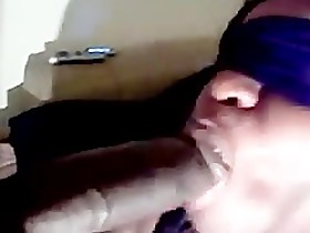 Blindfolded black wife sucks black cock