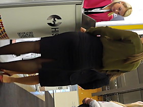 Candid expo girls in a office look black pantyhose and heels